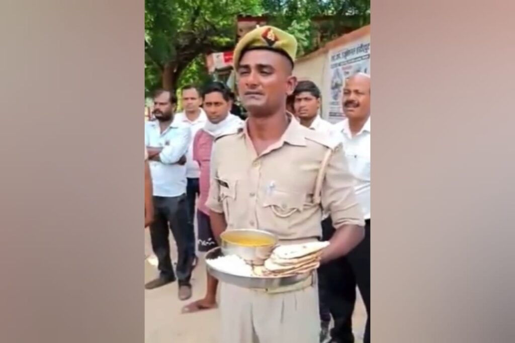 ‘Even dogs won’t…’: Viral video shows UP cop holding mess food in hand, complaining to passersby.