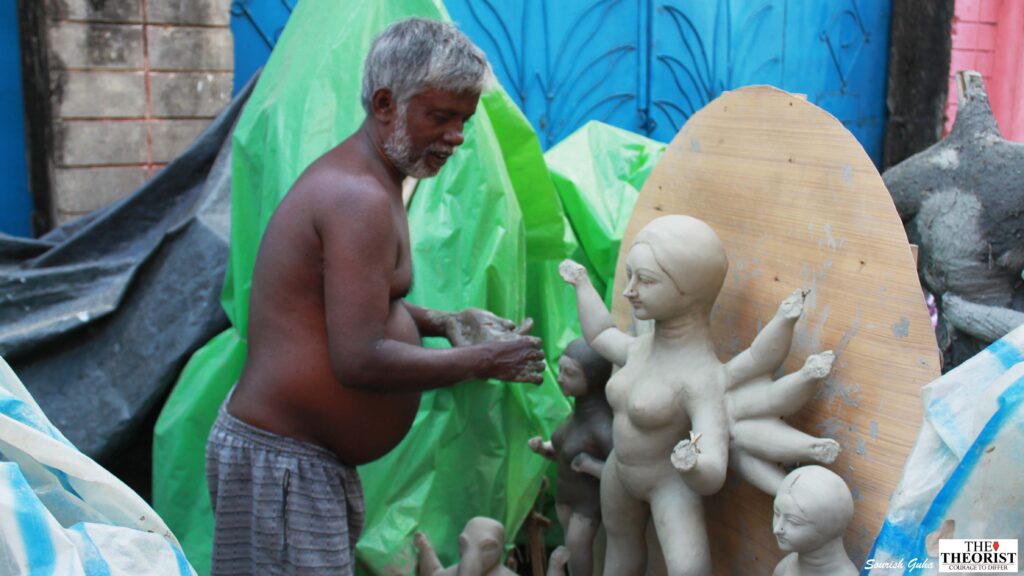 A man makes a Durga idol at Kumortuli | Photo: Sourish Guha